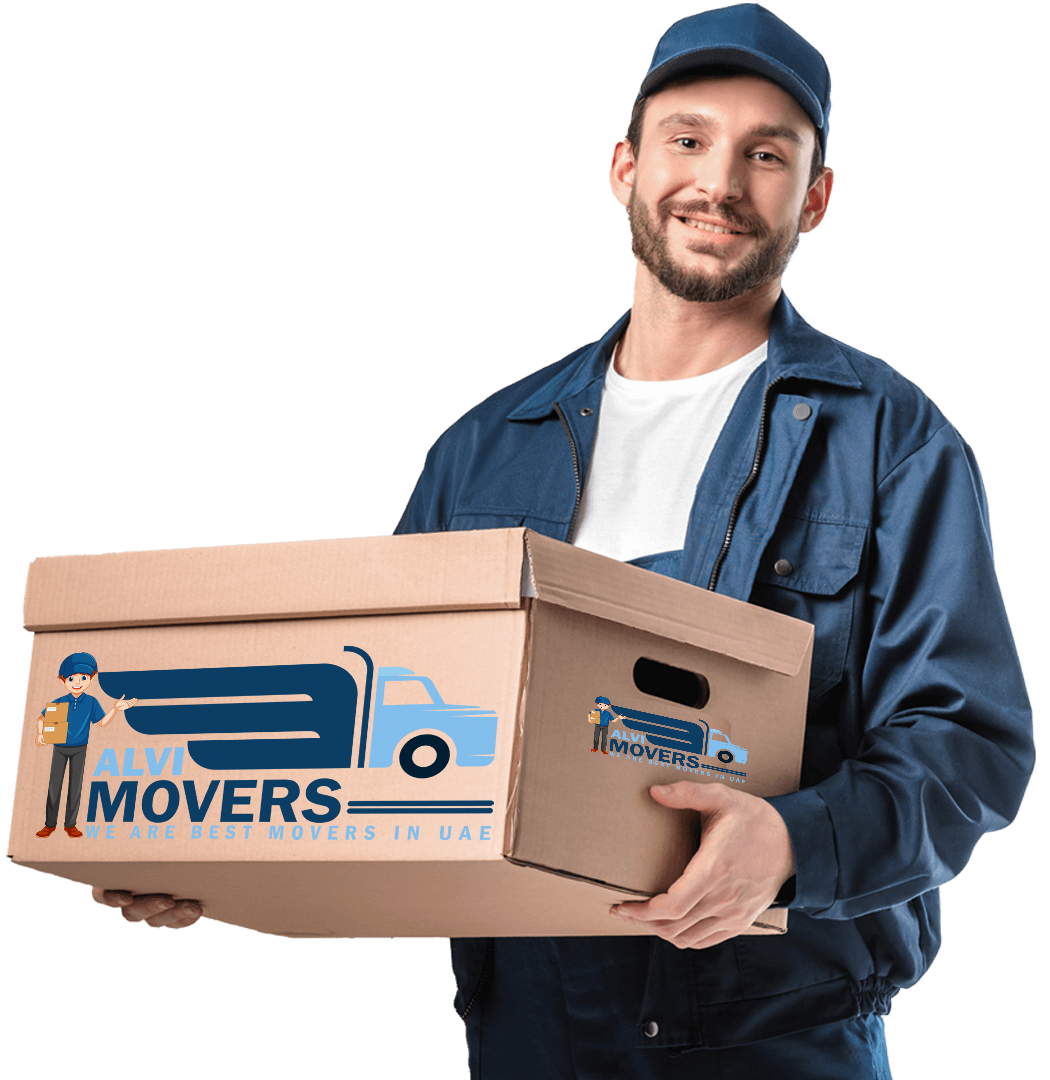 our smiling best movers and packers in UAE wearing alvi movers uniform caring a cardboard box